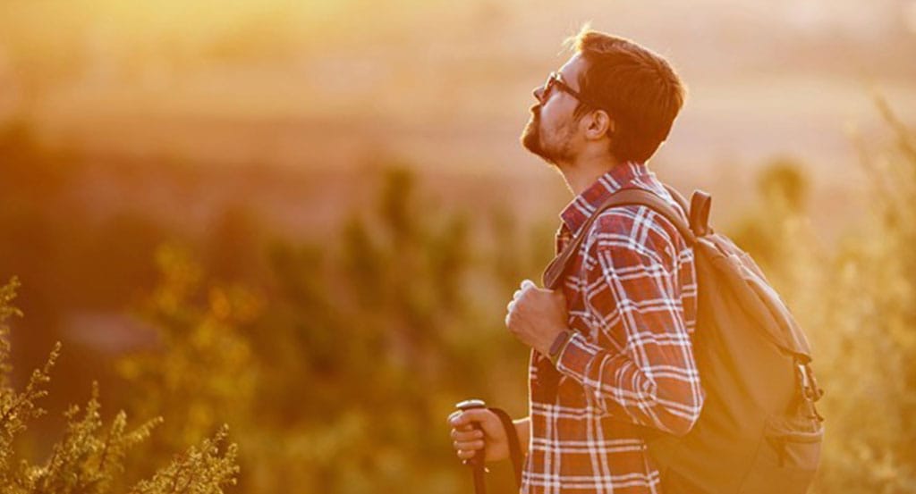 Ketamine treatment for chronic pain from Serenity Infuse in Stamford, CT illustrated by a man walking through a field