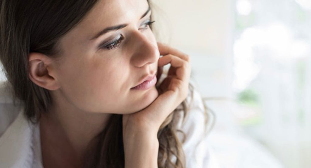 Ketamine mood treatment from Serenity Infuse in Stamford, CT illustrated by a woman looking sad